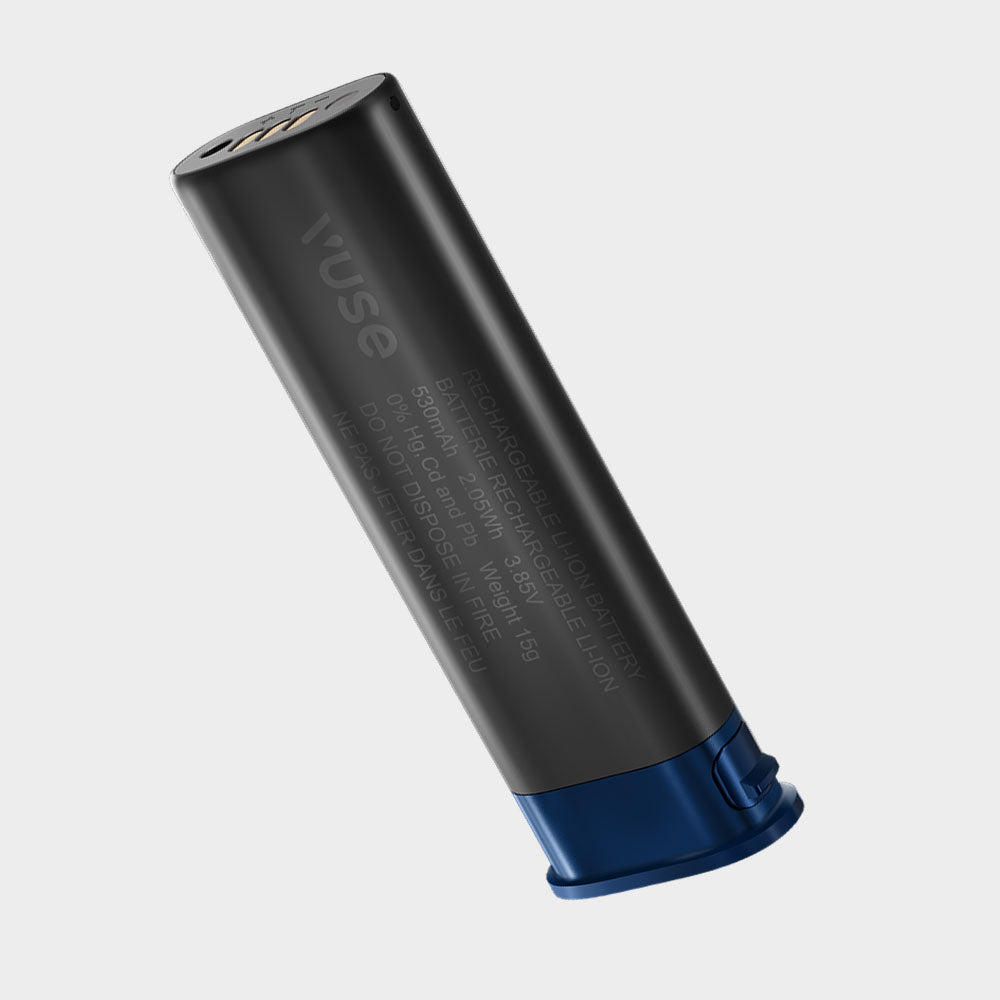 A black cylindrical Vuse vape battery with a blue base and metallic top, featuring product details text along the side, shown against a plain light gray background.