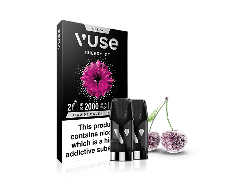 Vuse Cherry Ice vape pod packaging with two black pods in front and two frosted cherries beside the box. The box features a pink flower graphic and a nicotine warning label.