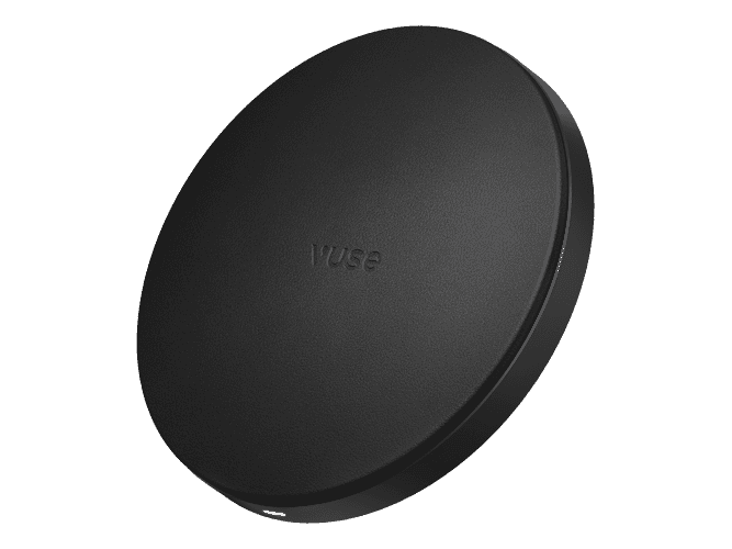 The Vuse Ultra Wireless Charger is a round, matte black pad with "Vuse" subtly embossed in the center, providing convenient charging against a plain light background.
