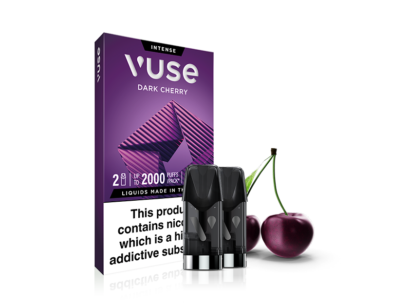 A box of Vuse Intense Dark Cherry e-liquid pods is shown with two pods in front and two cherries beside the box. The packaging features a purple geometric design and a nicotine warning label.