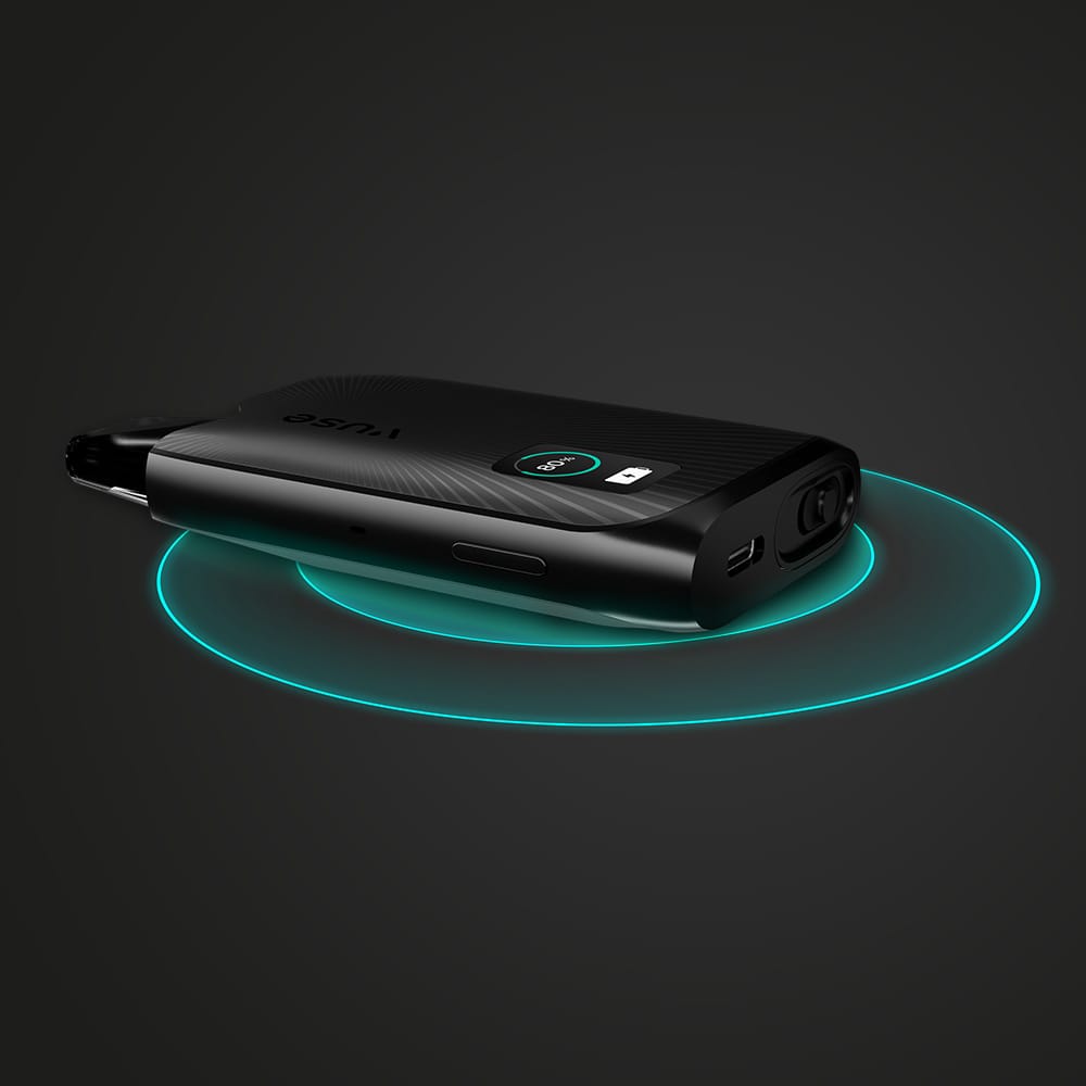 The Vuse Ultra Wireless Charger by Vuse is a sleek black pad with a digital display, USB port, and buttons. Shown on a dark background, it emits glowing blue concentric circles beneath it and displays numbers on its small screen.