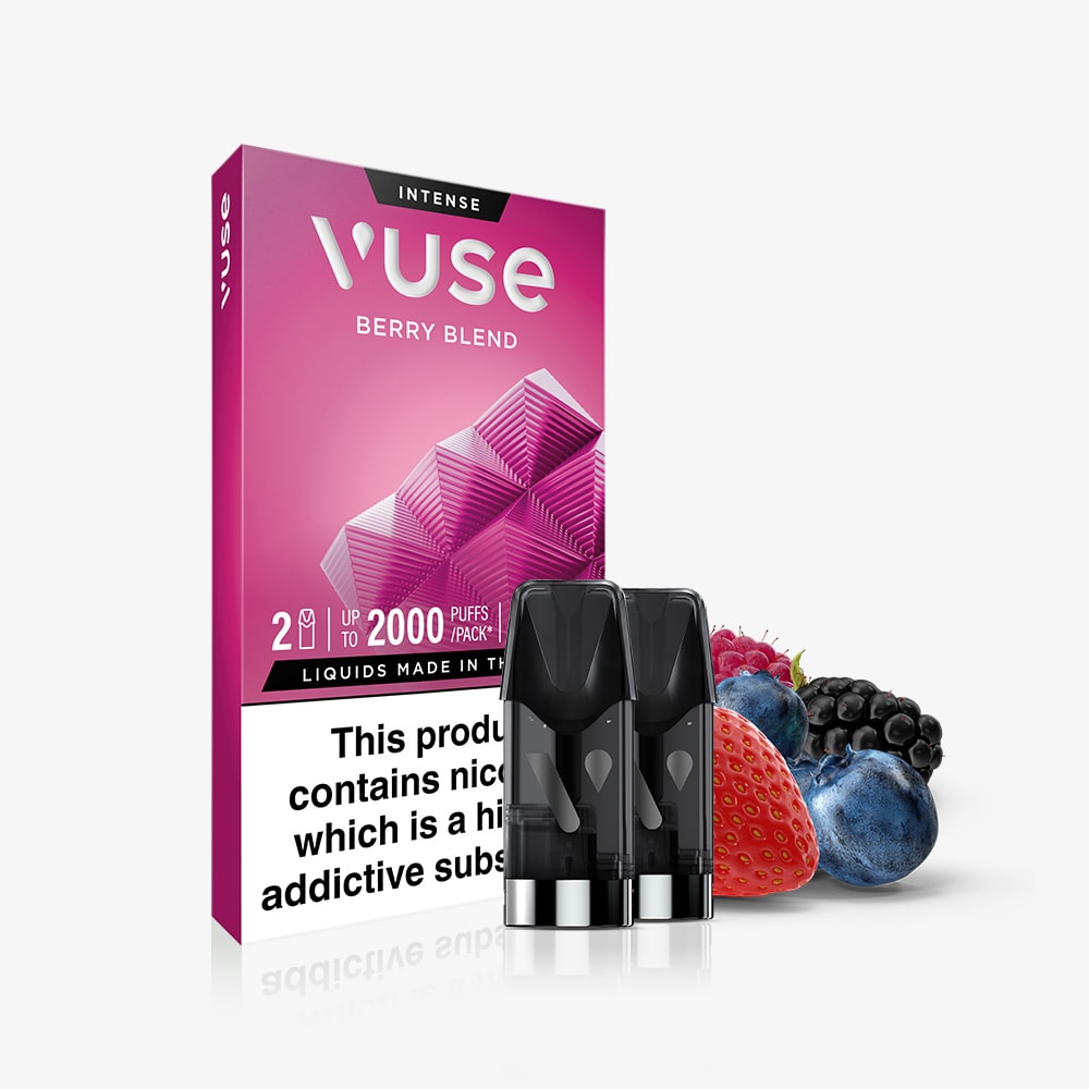 A Berry Blend Vuse Extra Intense Flavour Pods pack with two pre-filled pods is shown in front, surrounded by fresh strawberry, blueberry, and blackberry. The pink packaging has a nicotine warning label at the bottom.