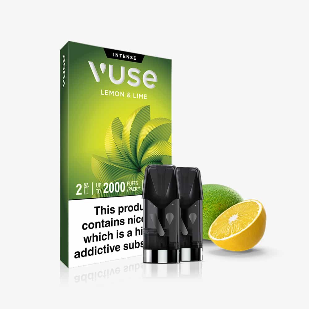 Vuse Lemon & Lime Vuse Extra Intense Flavour Pods packaging is shown with two pre-filled e-liquid pods in front, alongside a whole lime and a halved lemon, emphasizing the refreshing Lemon & Lime flavour. A warning label at the bottom indicates nicotine content—these pods are part of the Vuse Pods range.