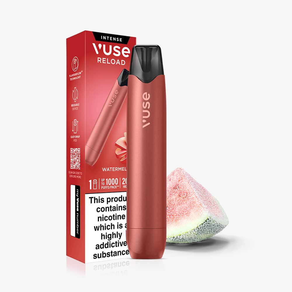 A coral-colored Watermelon Ice Vuse Reload Pen stands in front of its retail box, with a slice of watermelon resting to the right.