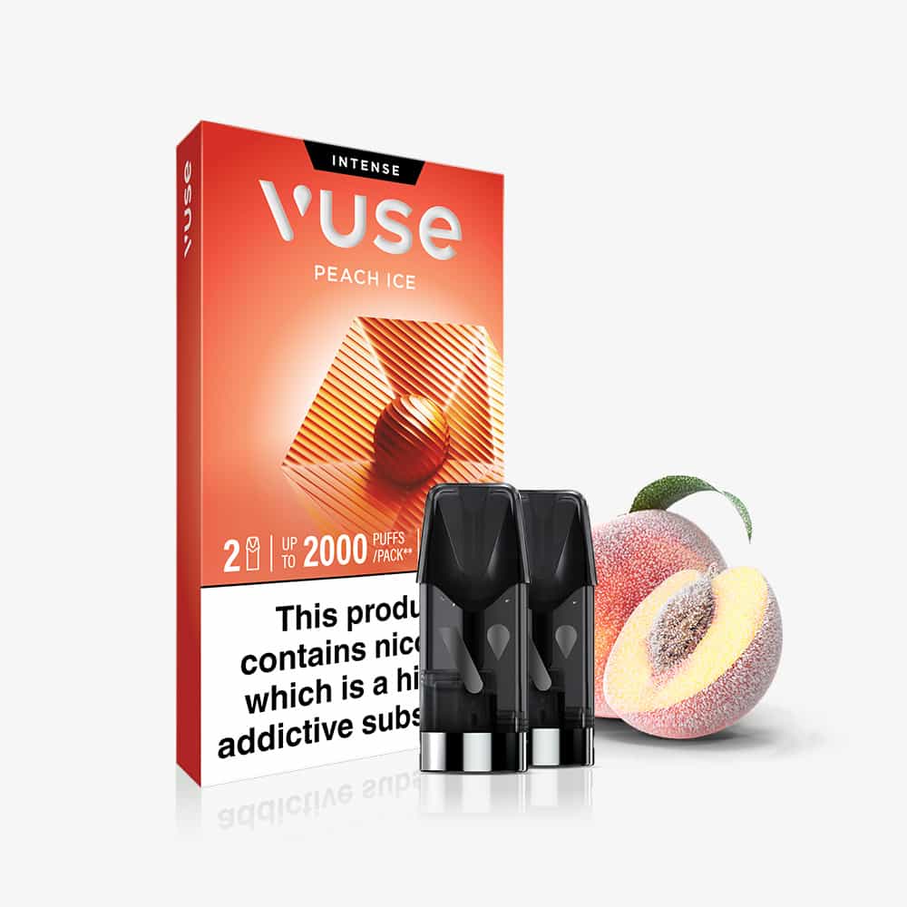 The packaging of Peach Ice Vuse Extra Intense Flavour Pods is displayed with two pods in front and a halved peach beside them. The box prominently warns that the product contains nicotine, which is highly addictive. Experience the refreshing taste and convenience of Vuse’s pre-filled e-liquid pods for a smooth, sustainable vaping experience.