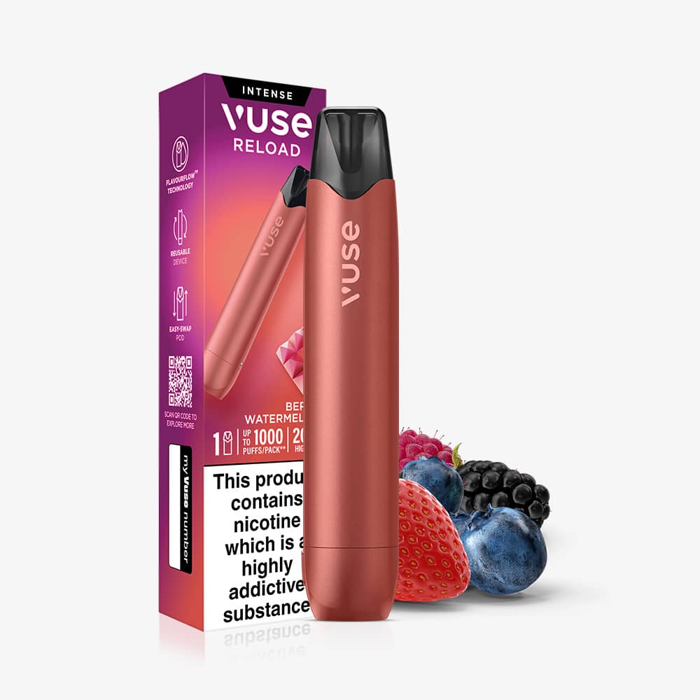 A red Berry Watermelon Vuse Reload Pen stands in front of its product packaging, accompanied by a small pile of strawberries, blackberries, and blueberries.