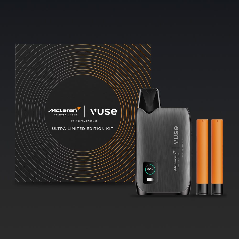 The Vuse Ultra Device Kit McLaren by Vuse includes the advanced device, two orange cartridges, and a black case with circular orange details and McLaren-themed logos.