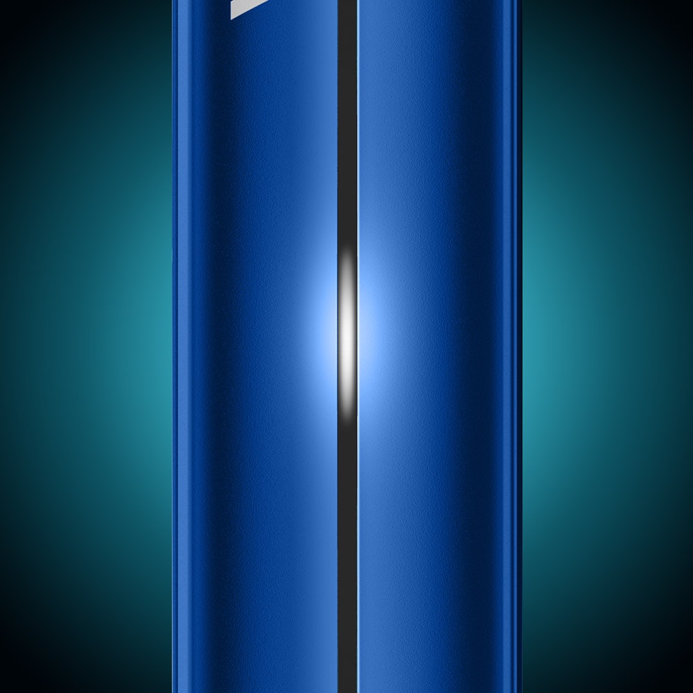 Close-up of a shiny blue metallic Vuse Pro Device Kit by Vuse, featuring a central vertical seam and illuminated by bright white light, set against a dark gradient background.