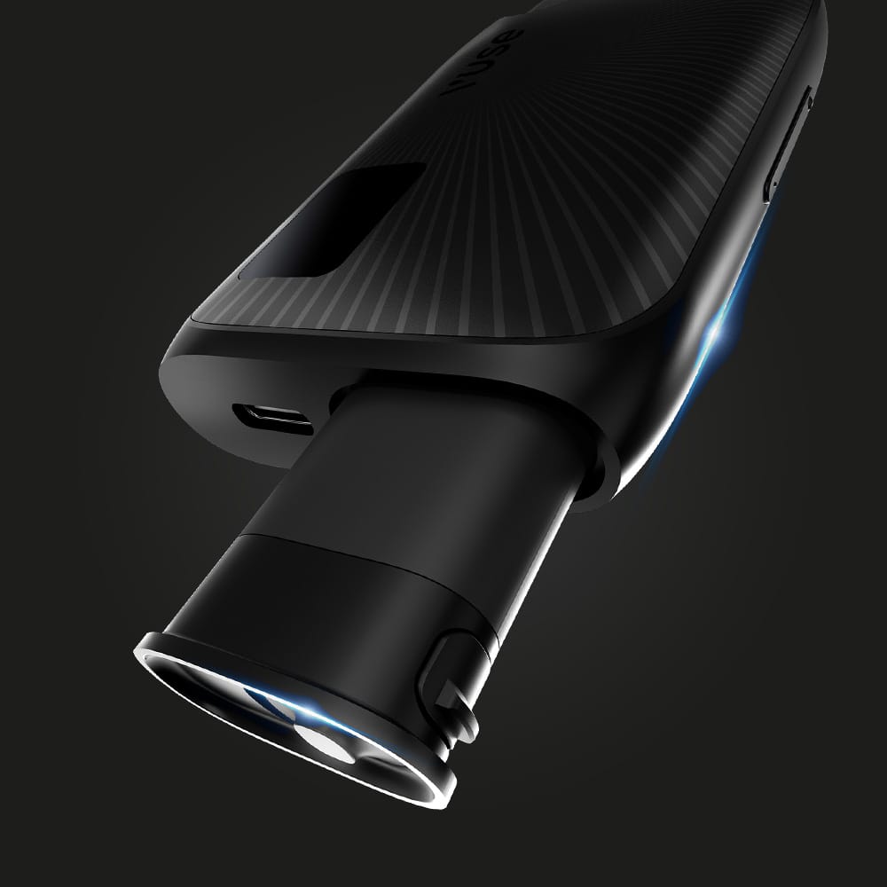 A close-up of the Vuse Ultra Replacement Battery by Vuse being inserted into a sleek, black vape, illuminated by blue LED lights against a dark background.