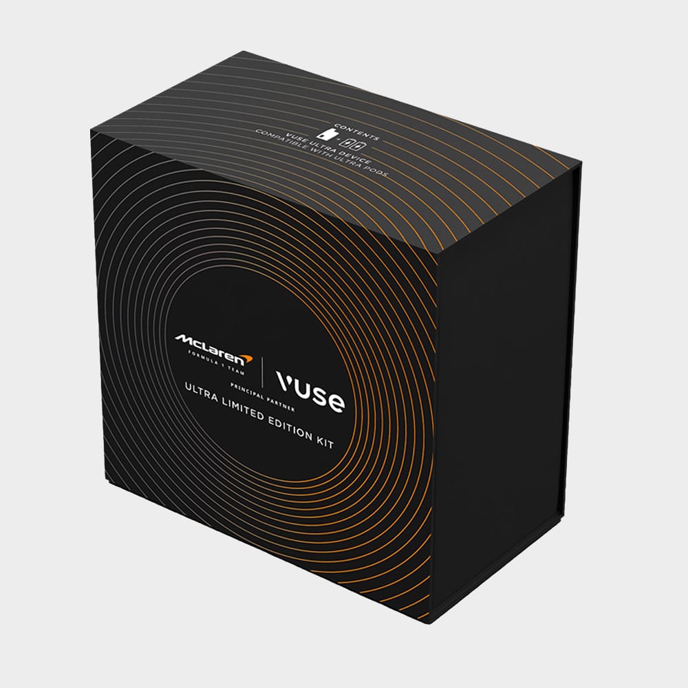 A black rectangular box with orange concentric circles, labeled McLaren | Vuse Ultra Limited Edition Kit on the front. The packaging has a modern, sleek design with metallic accents.