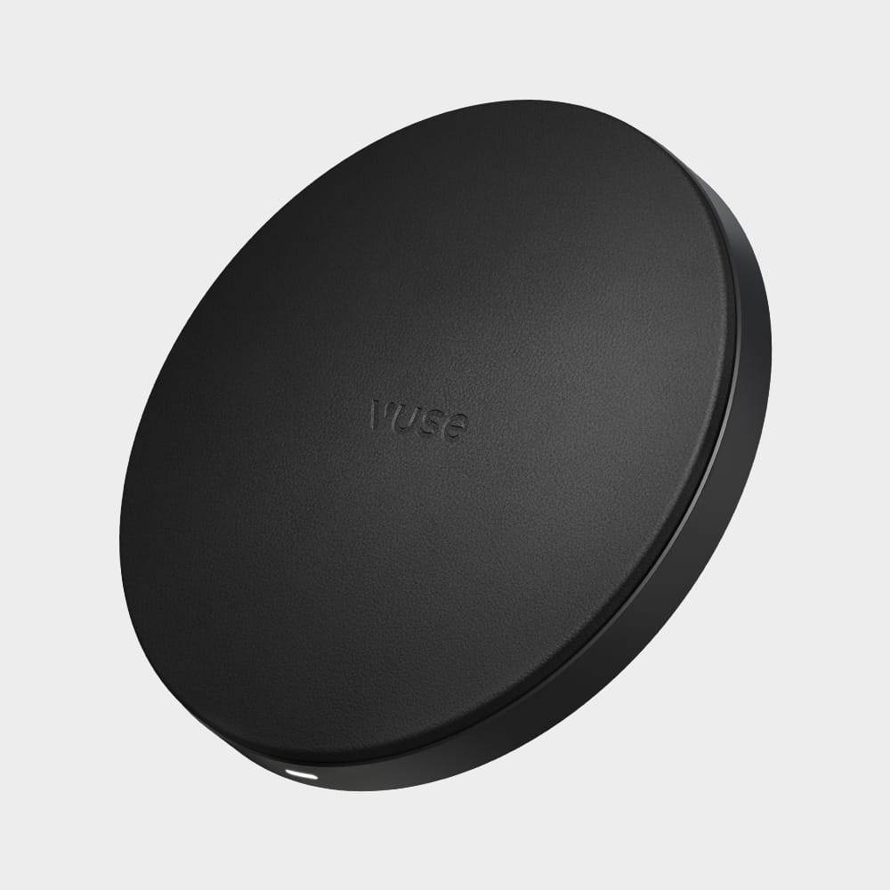 A black, round, flat device with the word Vuse embossed in the center, shown against a plain white background.