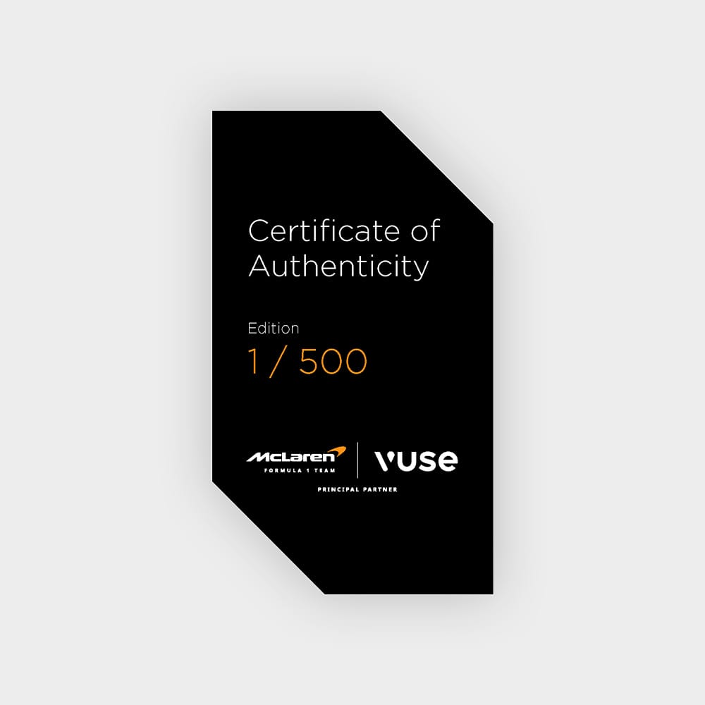 A black certificate with white and orange text reads: Certificate of Authenticity, Edition 1/500 and features McLaren Formula 1 Team and Vuse logos at the bottom on a light grey background.