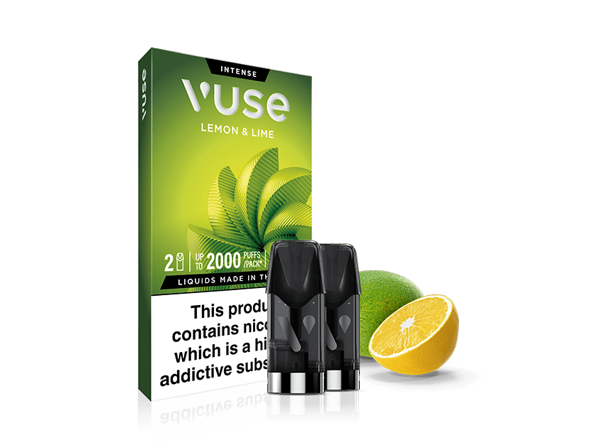 A Vuse Lemon & Lime e-liquid pods box is shown with three black vape pods in front, alongside a whole lime and a half-cut lemon, on a white background. The packaging warns of nicotine content.