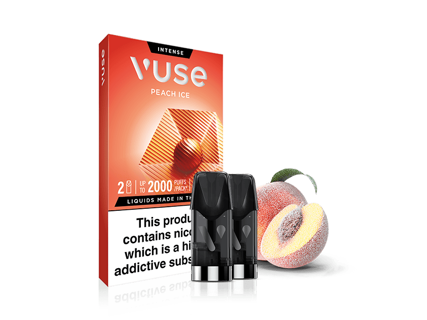 A box of Vuse Intense Peach Ice vape pods stands next to two vape cartridges and a peach with ice crystals. The packaging highlights “up to 2000 puffs” and a nicotine warning label.