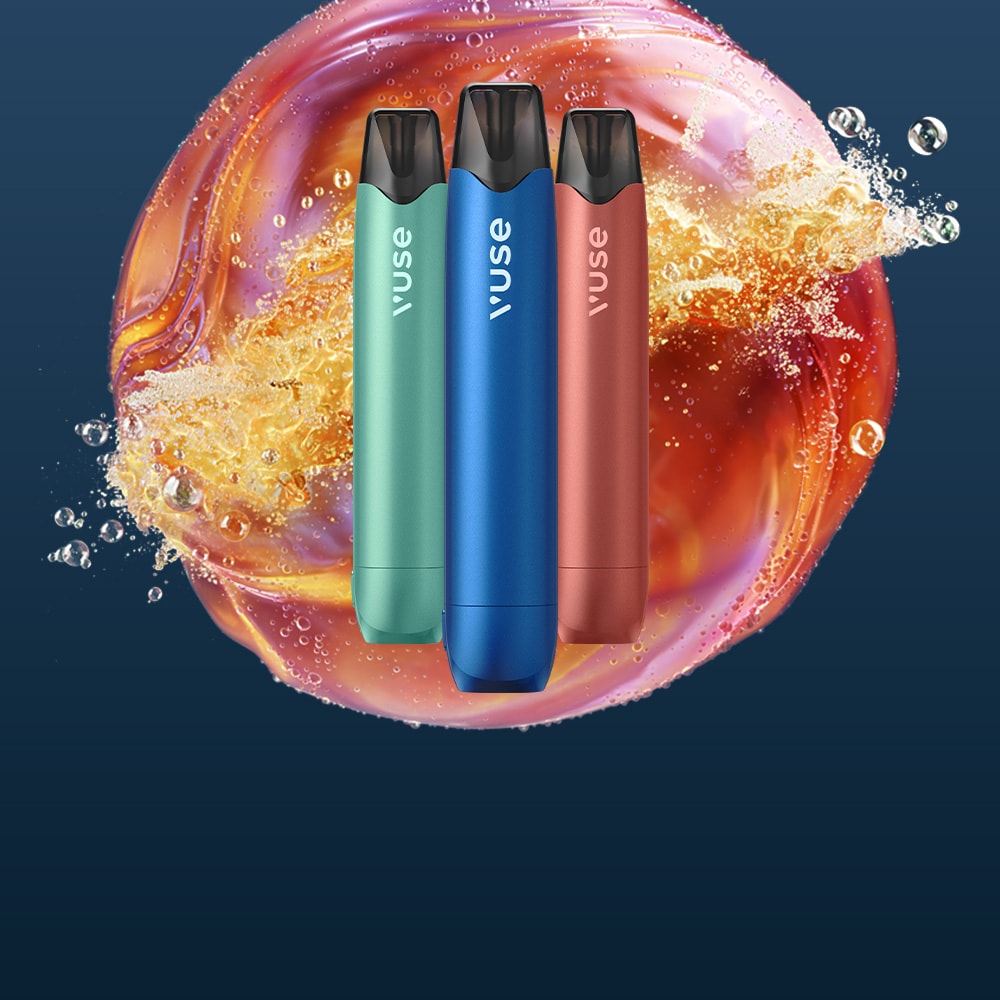 Three colorful Vuse vape devices—green, blue, and red—stand upright in front of a vibrant, swirling splash of liquid on a dark blue background.