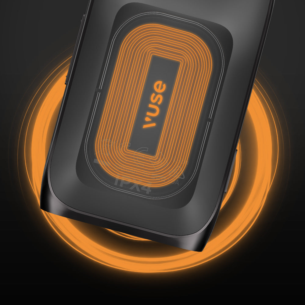 A black smartphone with a visible orange wireless charging coil is placed on a matching wireless charger, both glowing with orange light. The word vuse appears in the center of the charging pad.